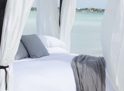 a bed on the beach