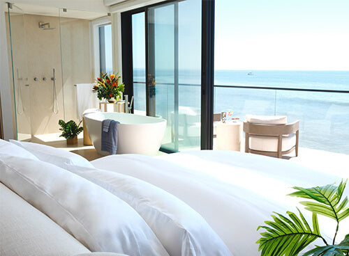 a bed with white bedding