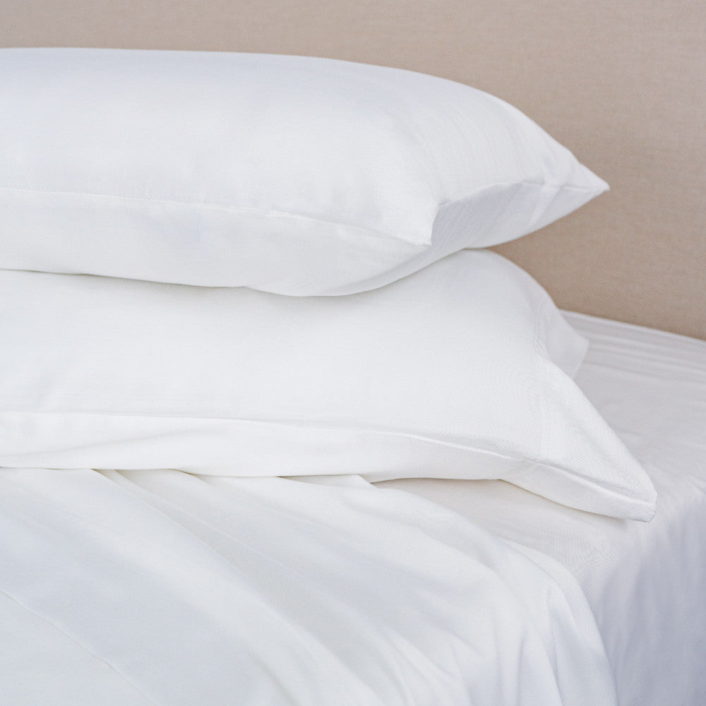 white classic pillowcases on pillows