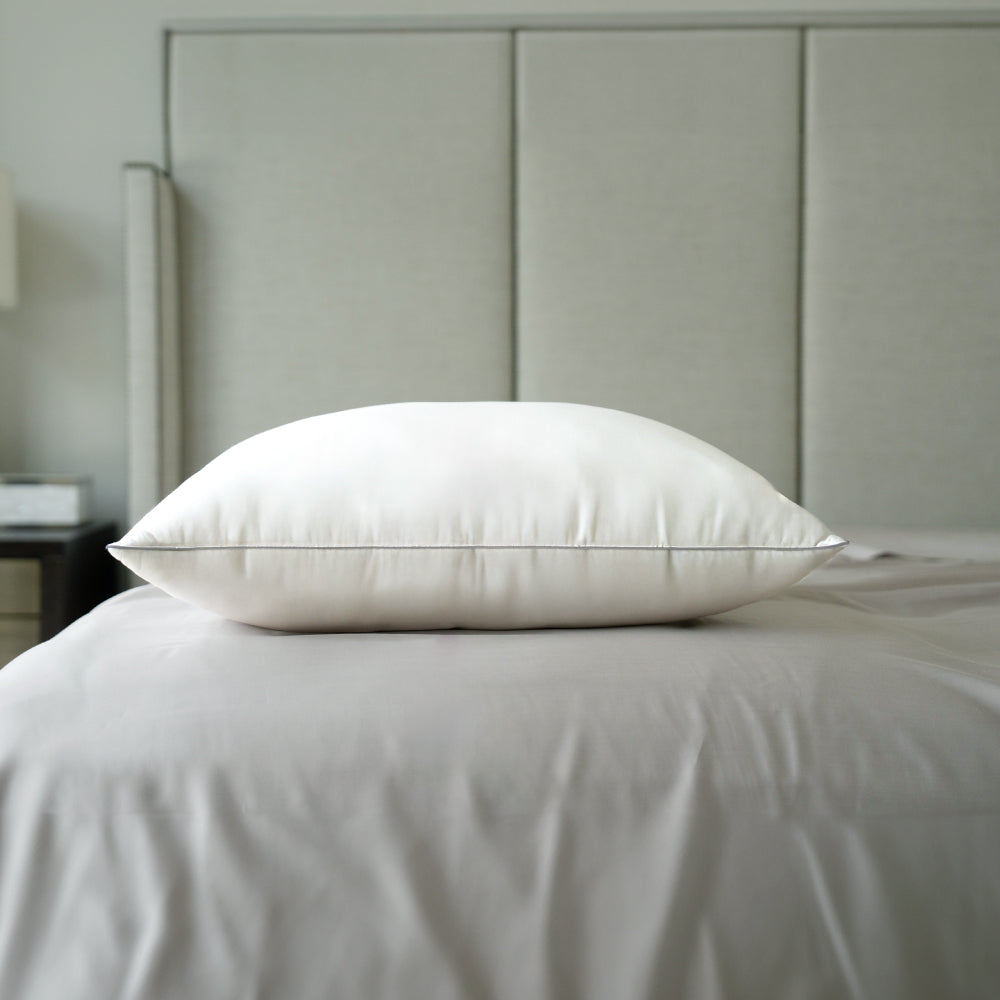 a down alternative pillow on a bed