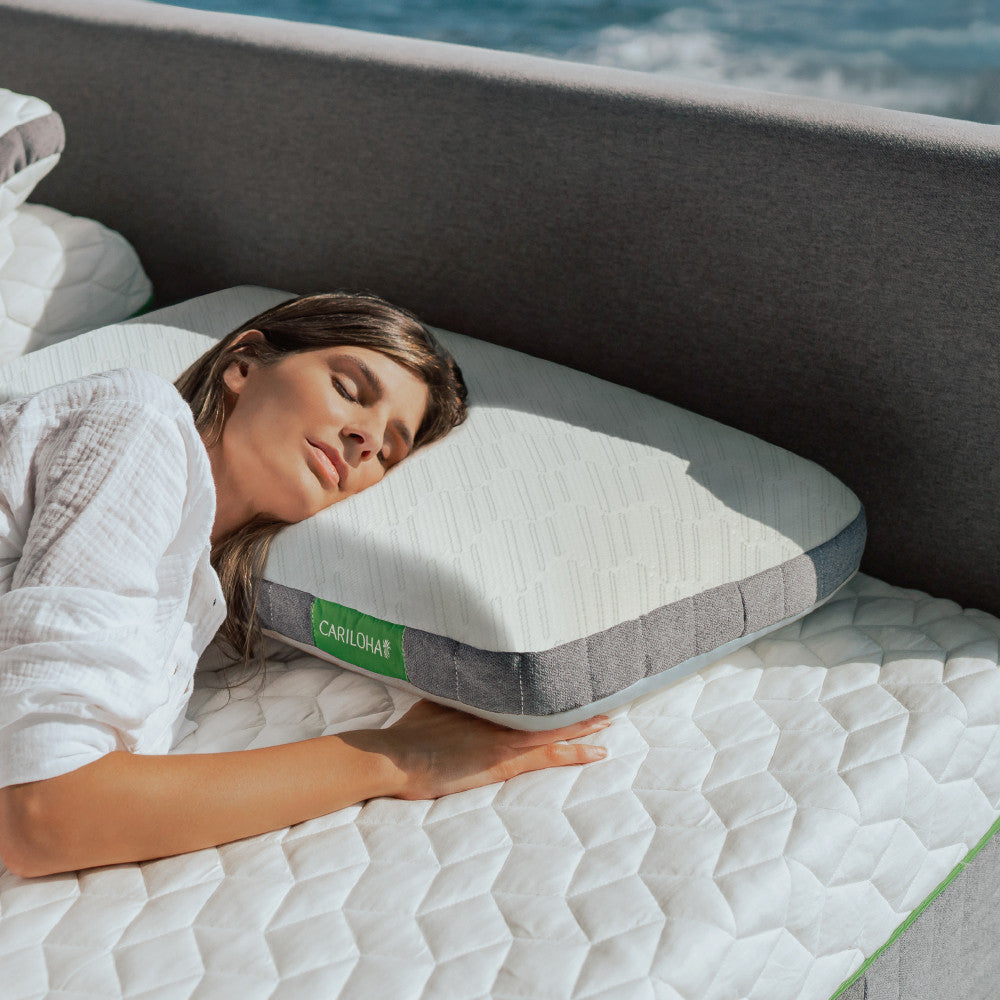 a woman lying on a cariloha classic pillow ~Standard