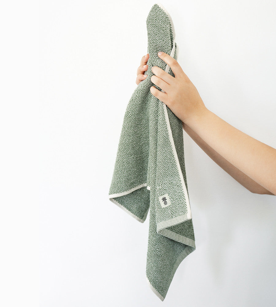 models hand holding up hand towel~Oasis Green