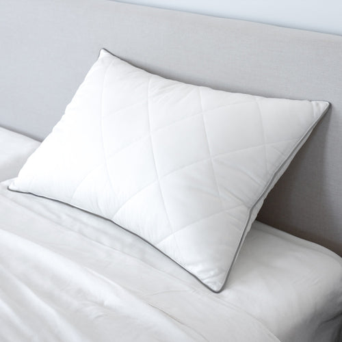 down feather pillow on a bed