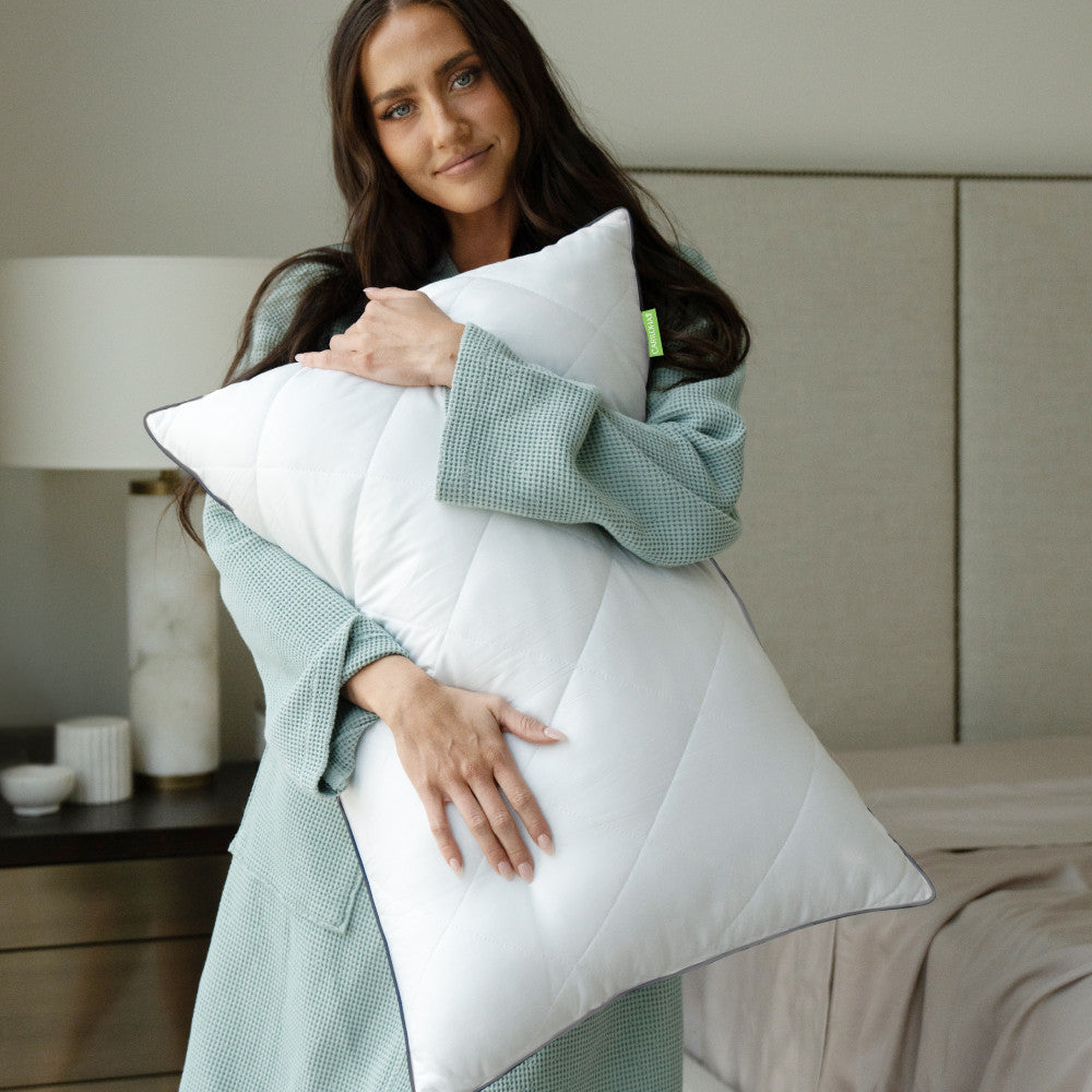 model hugging down feather pillow