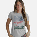 front view of model wearing a silver shore crew tee with our beach landscape design
