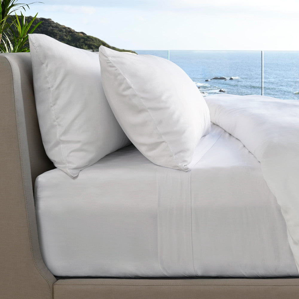 White resort sheets on a bed