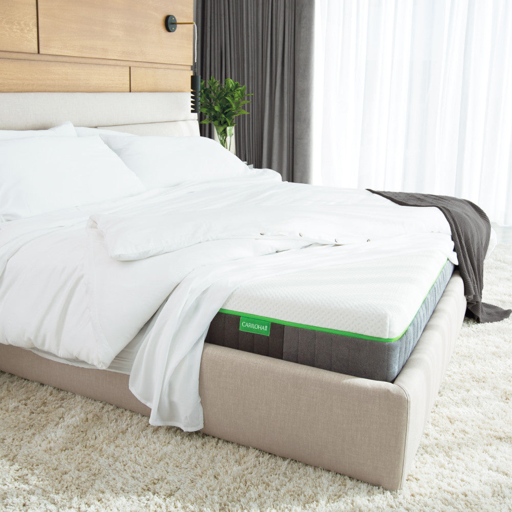 made bed with the corner up showing cariloha mattress~Twin