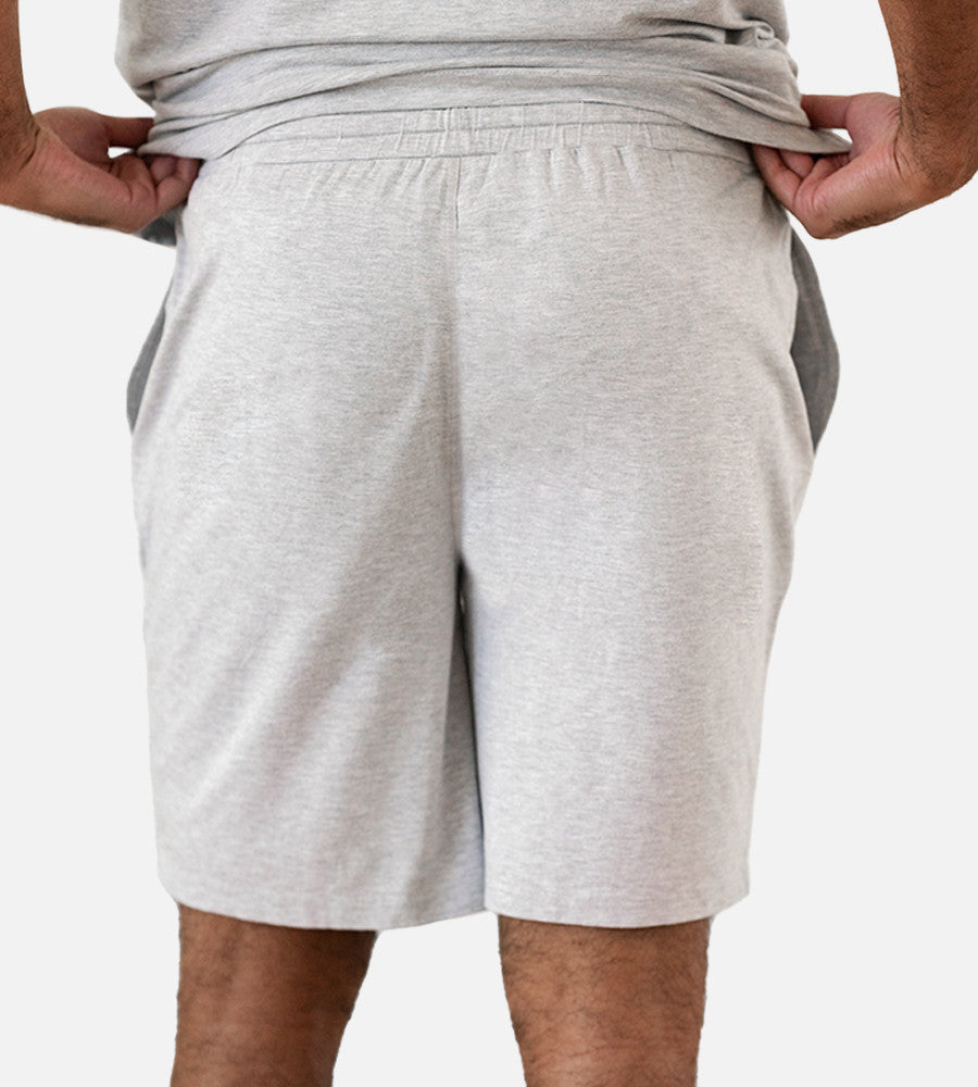 close-up back view of model wearing light gray shorts