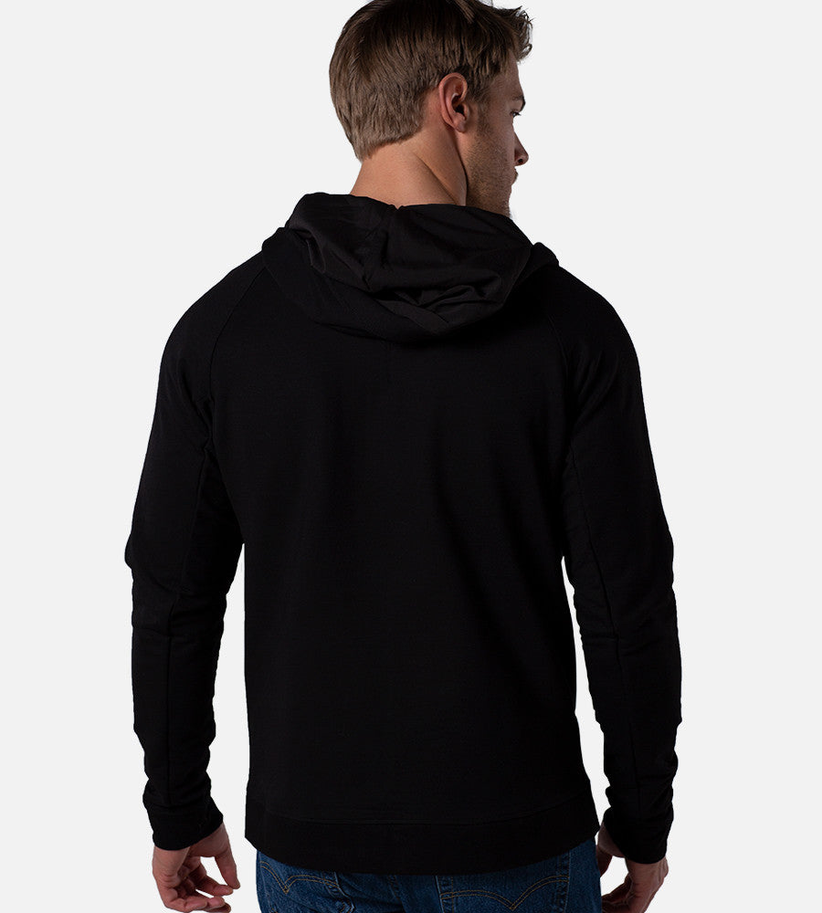 back view of model wearing black zip hoodie