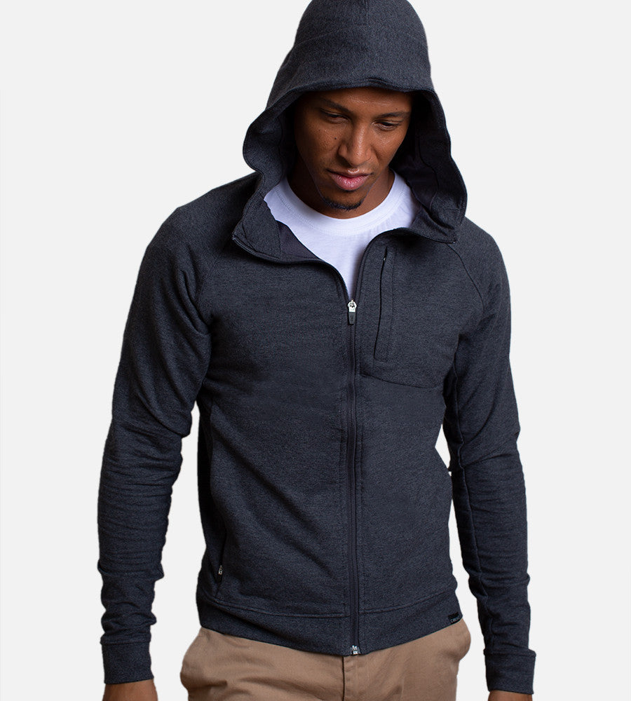 front view of model wearing charcoal zip hoodie with the hood up~Charcoal Heather