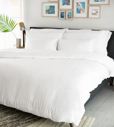 bed with sateen white duvet cover