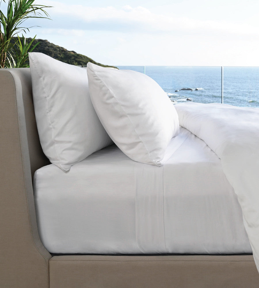 side of bed showcasing white resort sheets