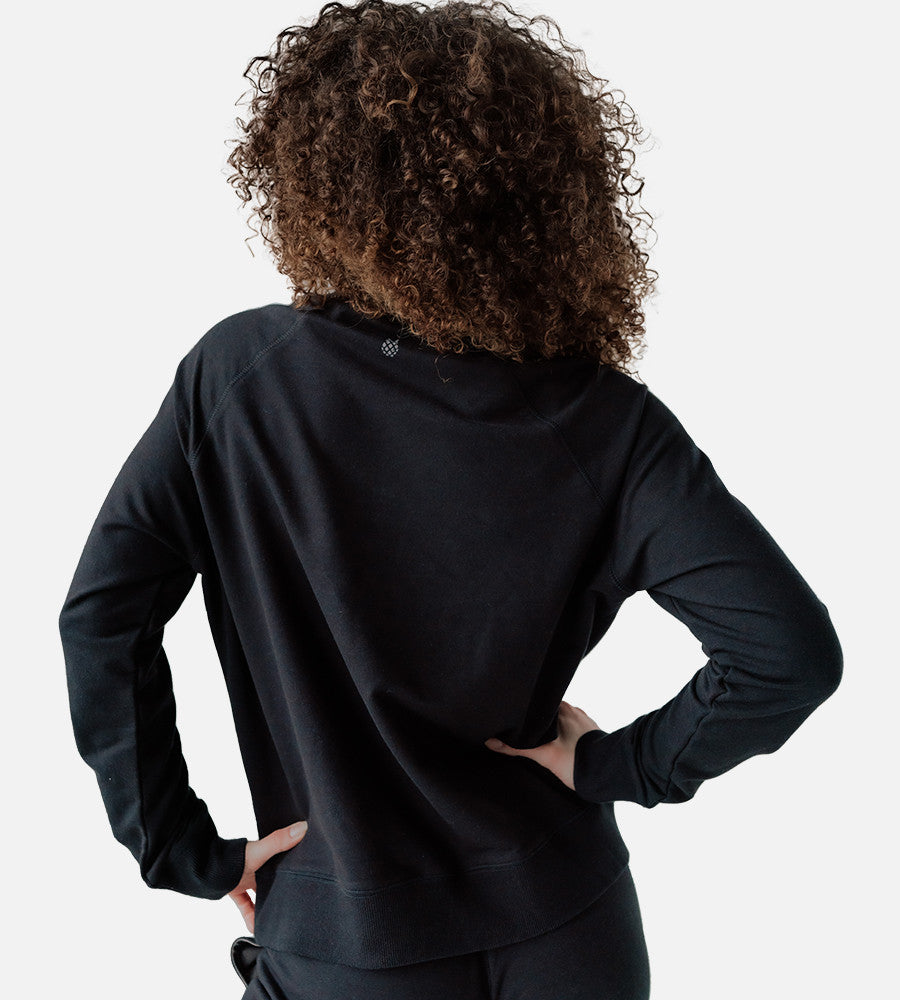 back view of model wearing black pullover sweatshirt~Black