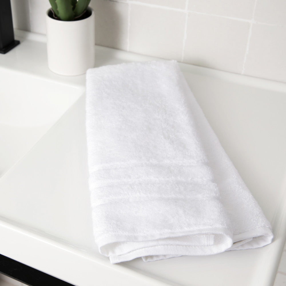folded white hand towel~White