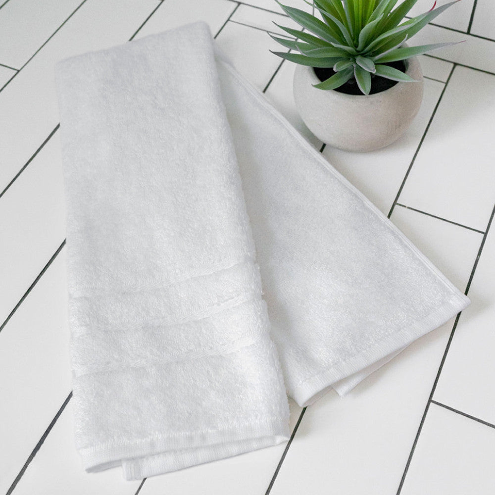 folded white hand towel~White