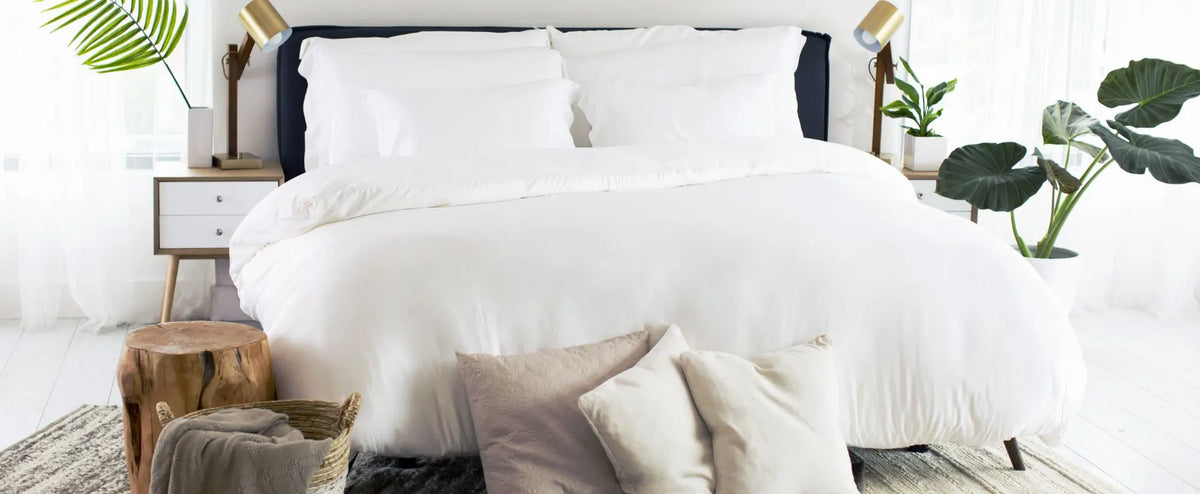 A bed with cariloha bedding in a modern bedroom