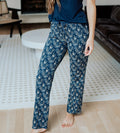 view of models legs wearing midnight floral print pants