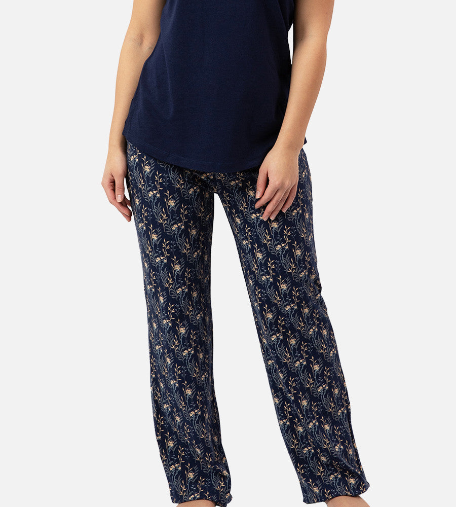 front view of models legs wearing midnight floral print pants