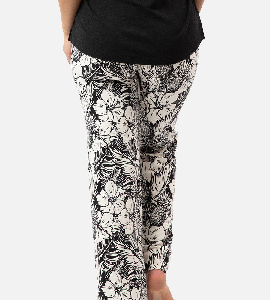 back view of models legs wearing soft black pineapple print pants