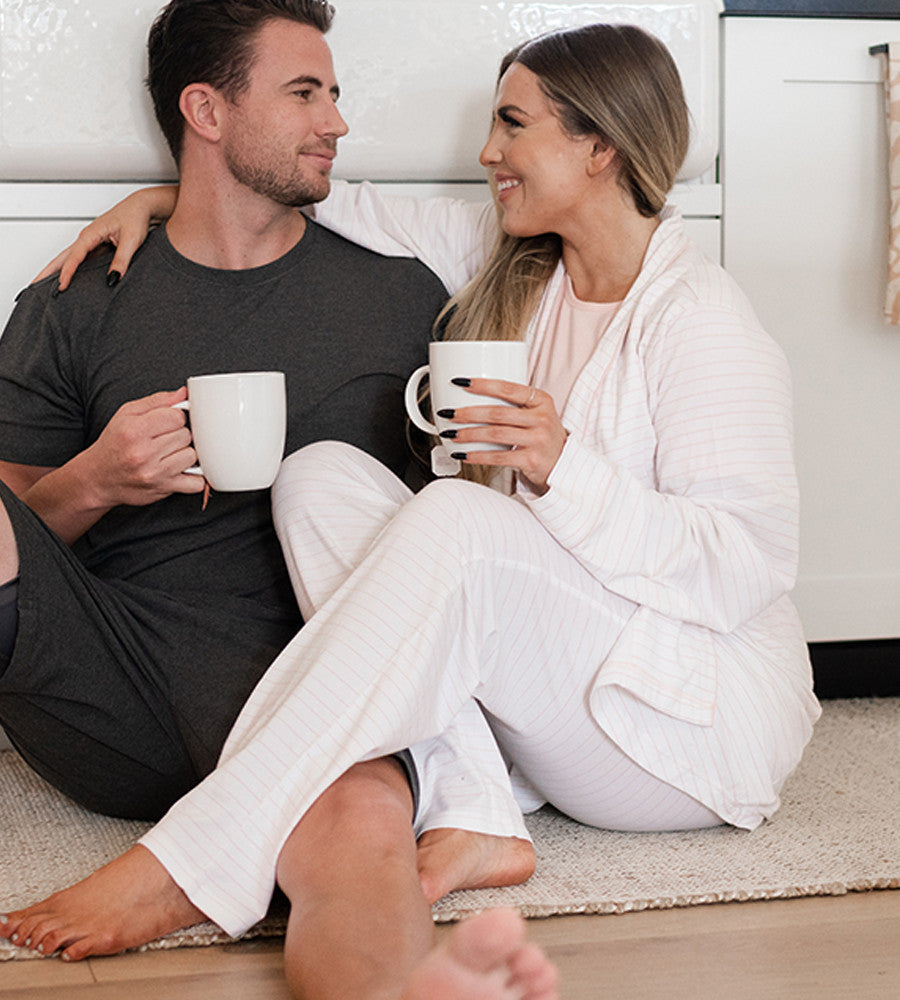 two models man and woman and woman is wearing soft pink robe