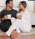 two models man and woman and woman is wearing soft pink robe