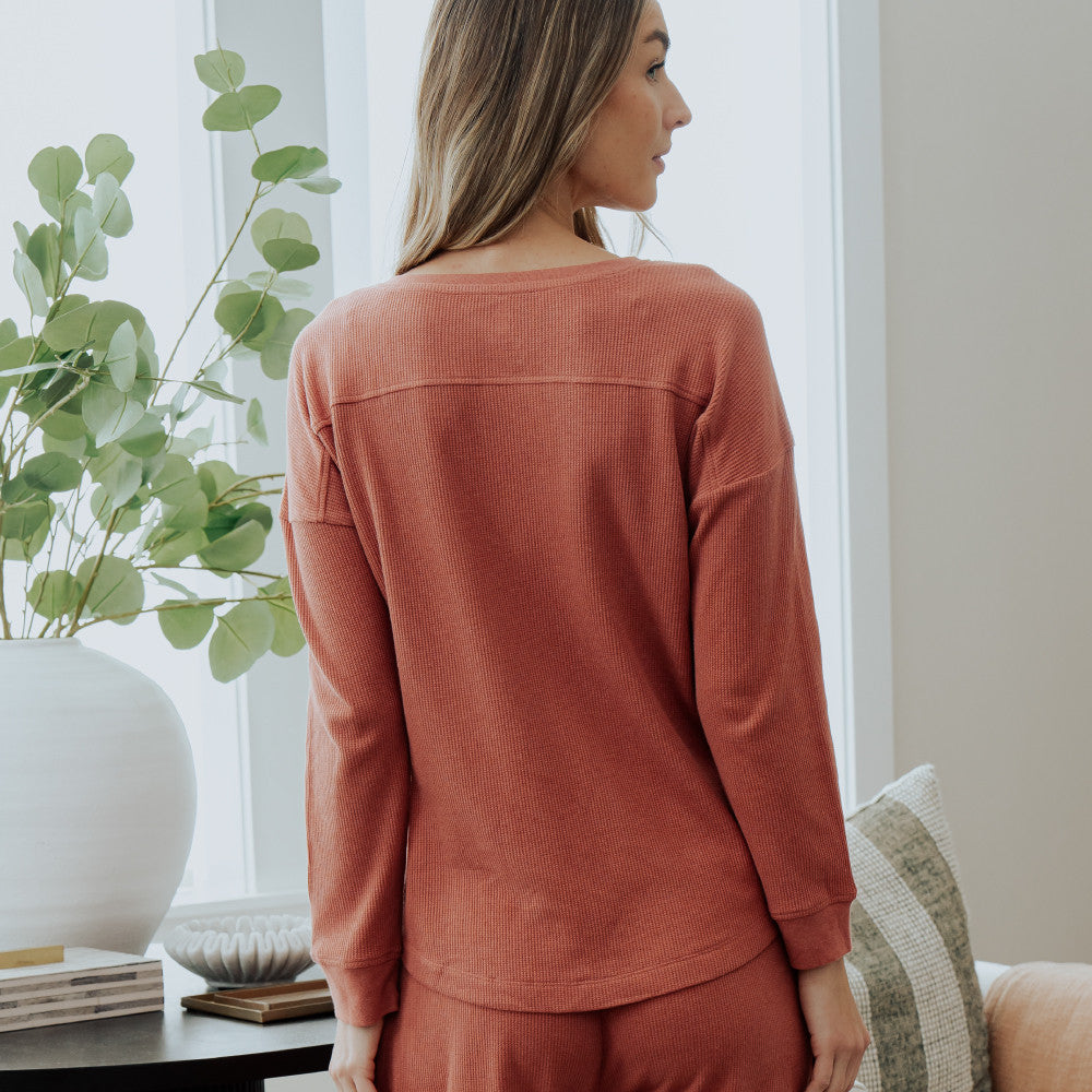 back view of model wearing coral dusk long sleeve