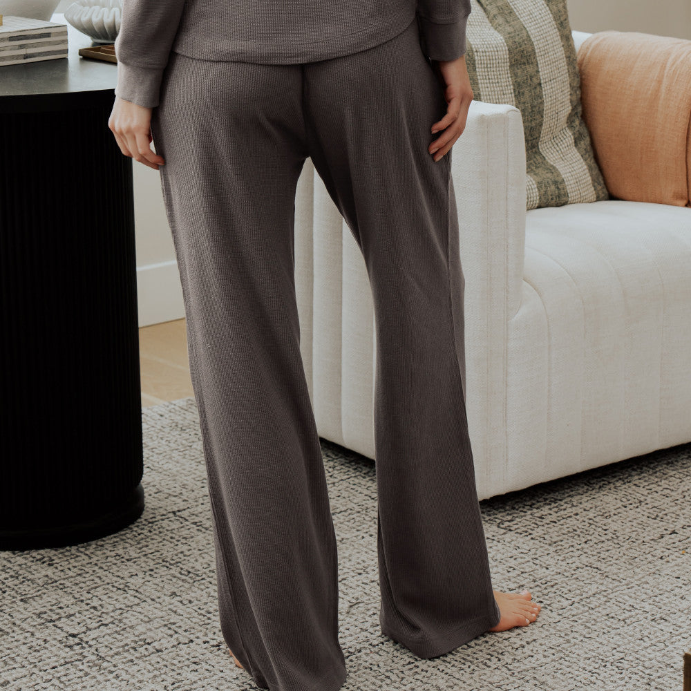 back view of model wearing charcoal pants