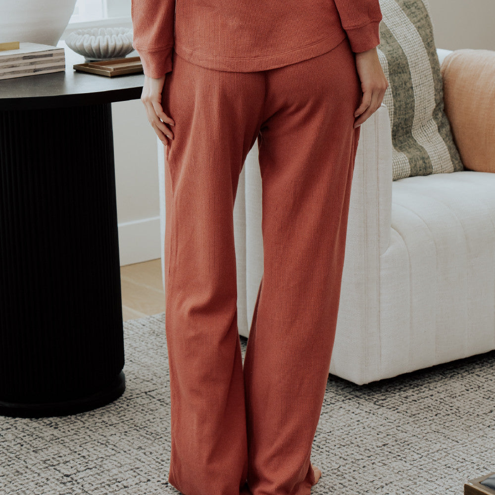 back view of model wearing coral dusk pants
