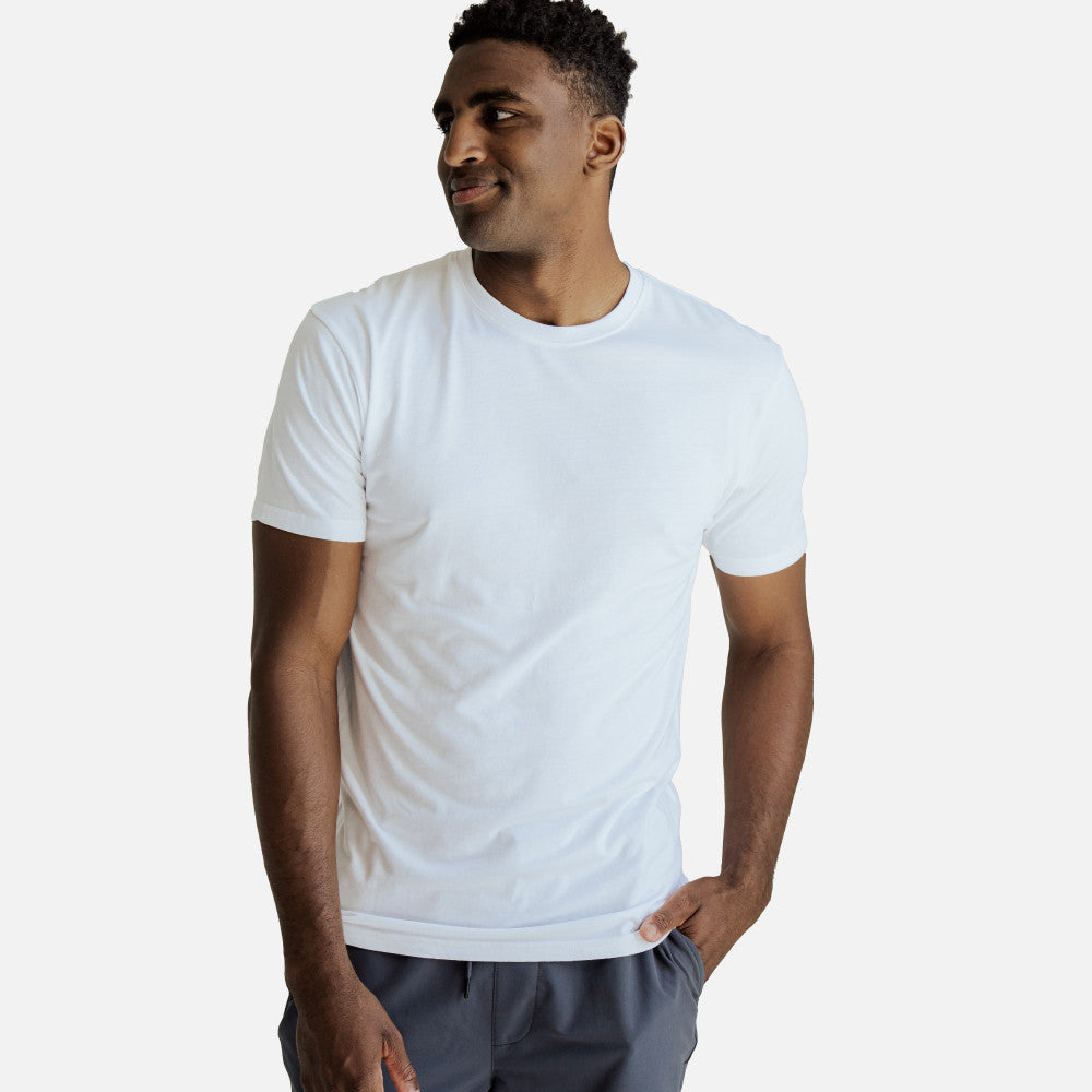 front view of model wearing white crew tee