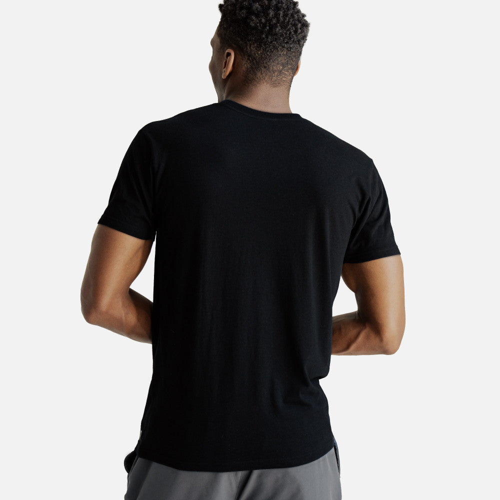 back view of model wearing black crew tee