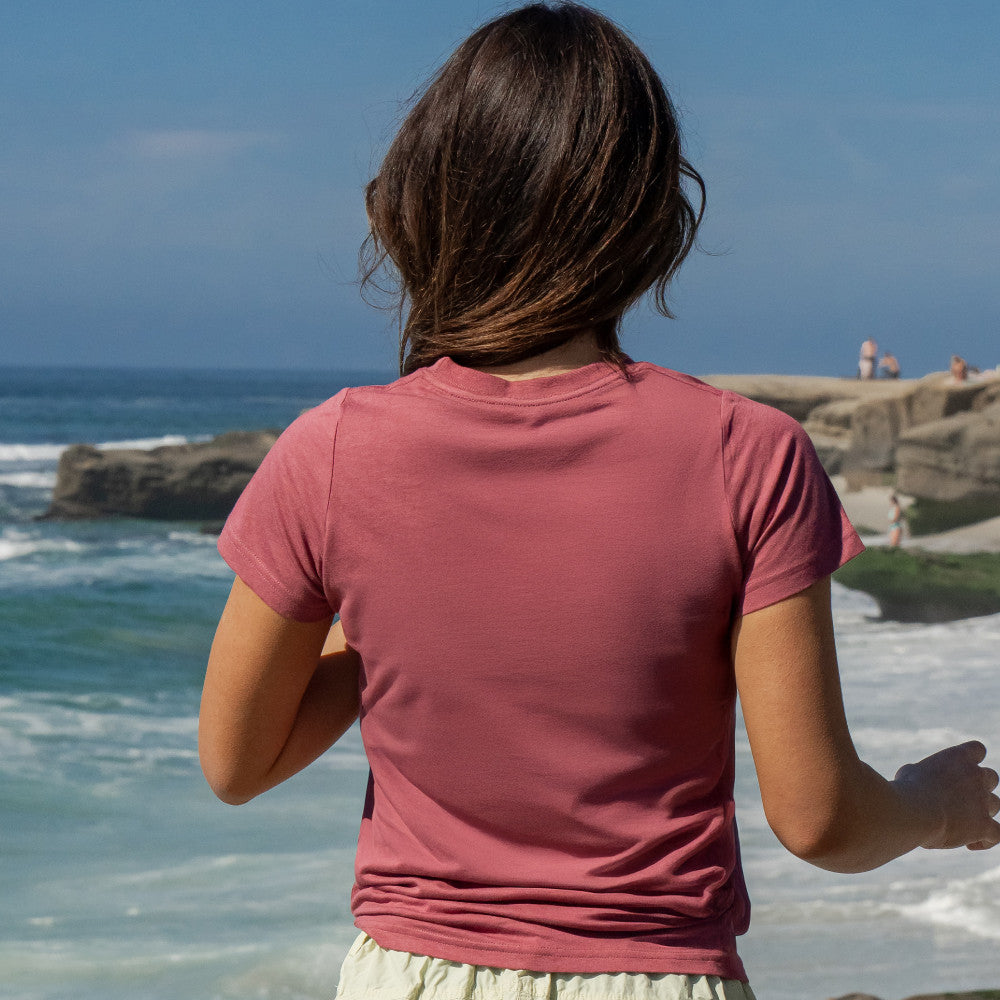back view of model wearing hibiscus red crew tee