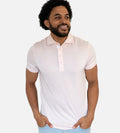 front view of model wearing light pink comfort polo~Light Pink