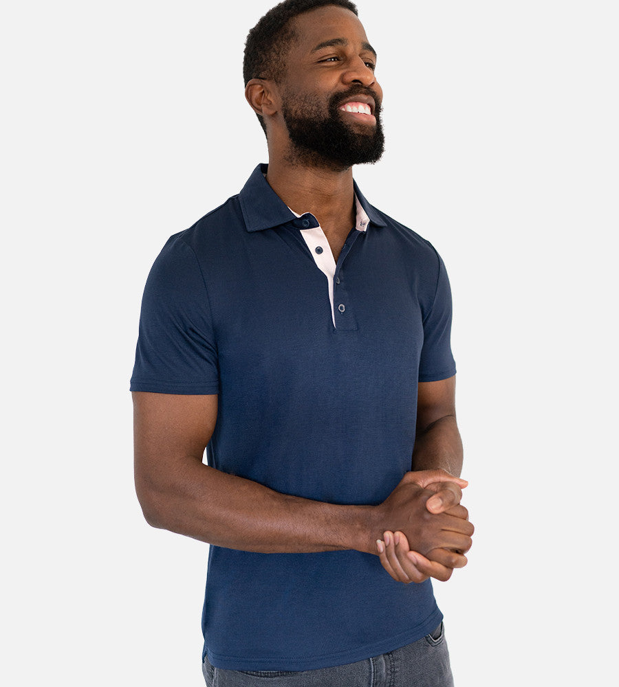front view of model wearing navy comfort polo~Navy