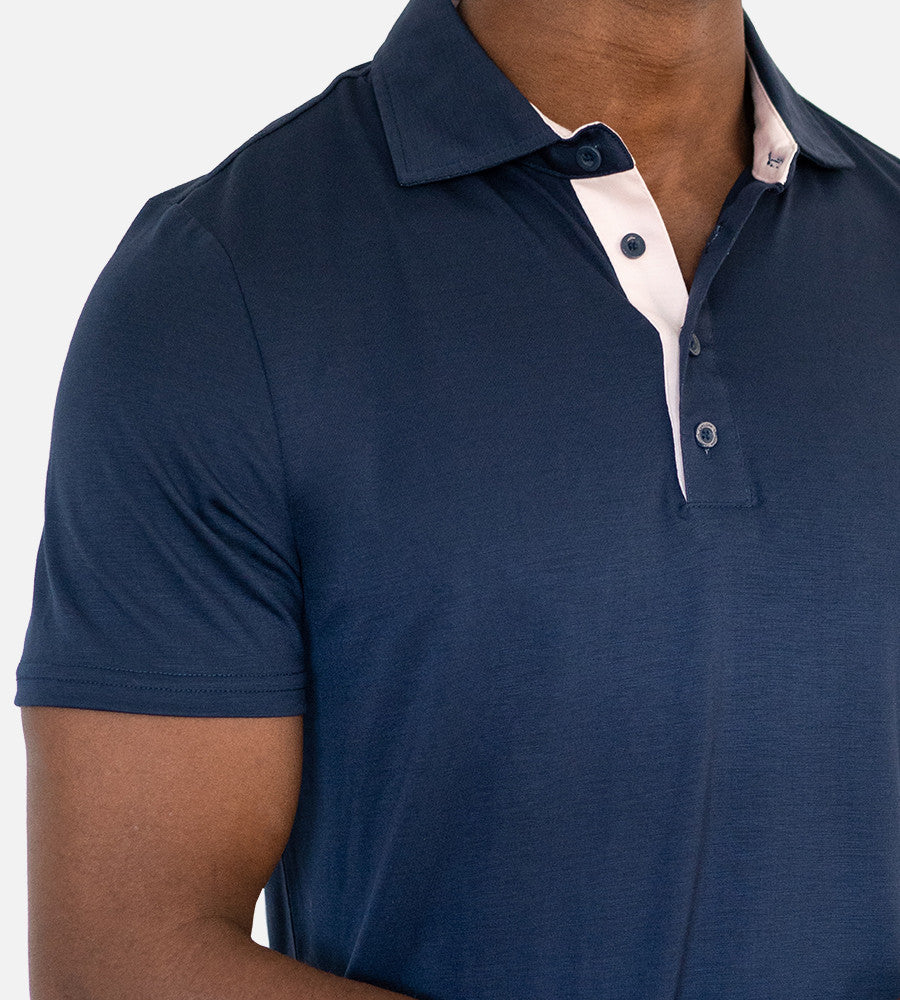 close-up on chest of navy comfort polo~Navy