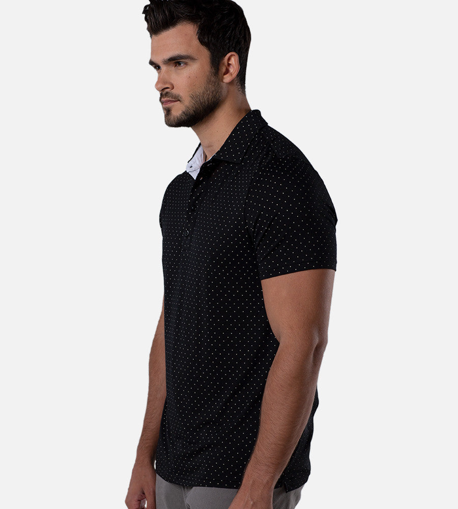 side view of model wearing dot black/white comfort polo~Dot Black/White