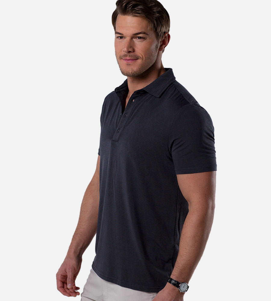 side  view of model wearing stripes charcoal/black comfort polo~Stripes Charcoal/Black