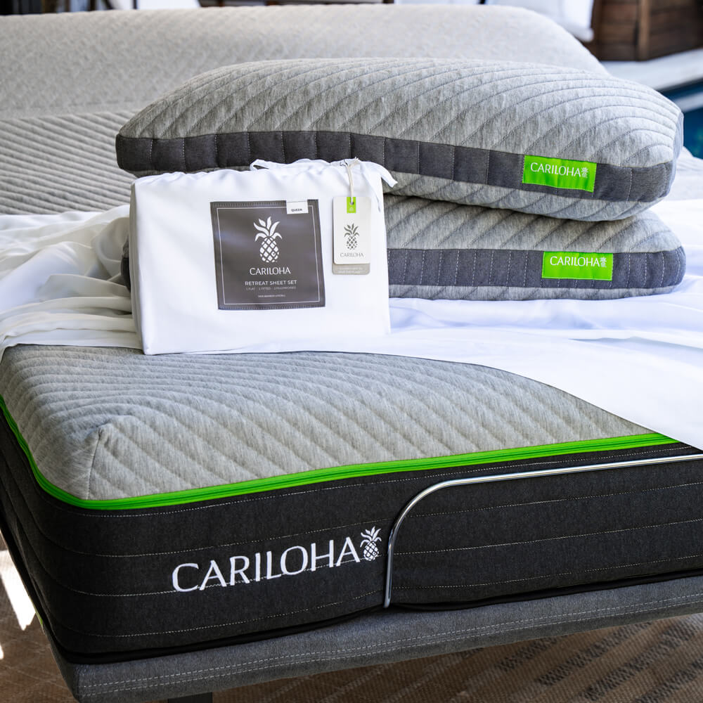 cariloha sheet packaging and pillows on a cariloha mattress