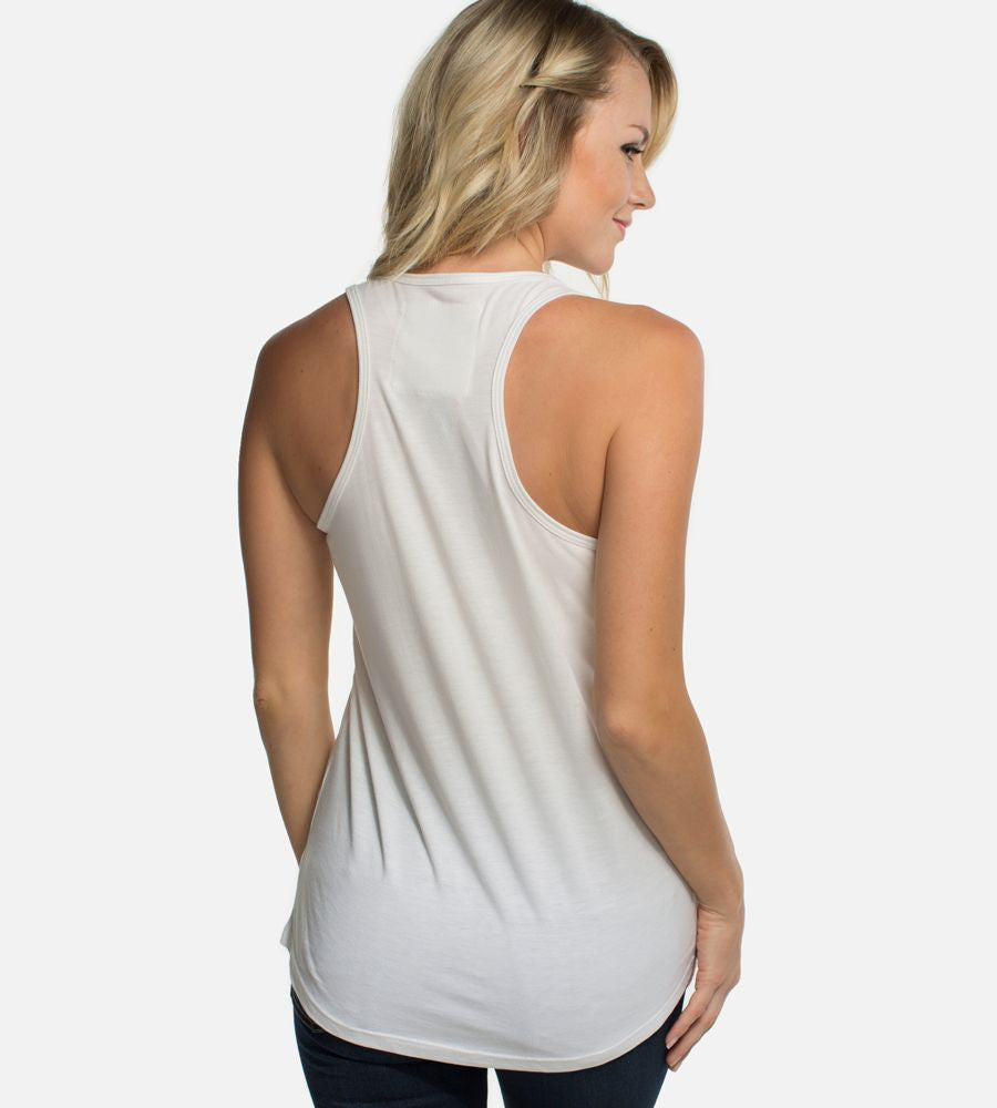 back view of girl wearing cariloha white racer tank